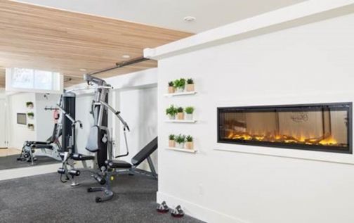 Linear electric fireplace in a home gym