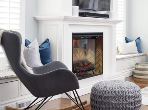 electric fireplace with cozy living room with grey chair