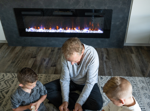 Sierra Linear Electric Fireplace, Grandfather playing with kids 