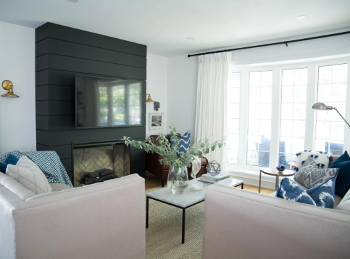 Stylist Jaclyn Harper chose a Dimplex Revillusion electric fireplace and black shiplap wall as the focal point in her new open concept living space.