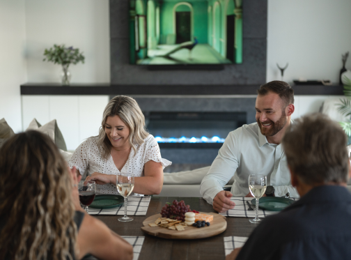 Sierra Linear Electric Fireplace, group of people enjoying a meal