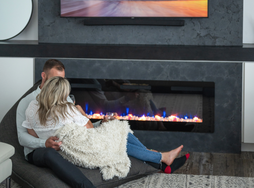 couple sitting in front of a Sierra fireplace