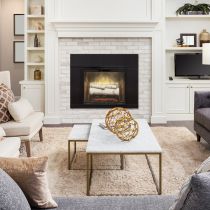 Living room setting with a wall-mounted fireplace as the centre piece