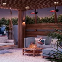 Radiant heaters warming an outdoor patio at night time