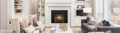 Dimplex Revillusion Built-In Firebox set into a white mantle at the center of a large family room.